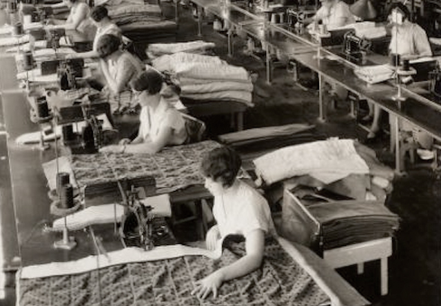 Trimmers hand-finishing upholstery in an earlier generation